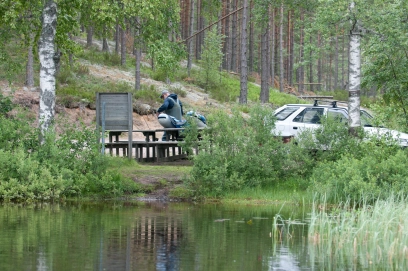 Bench, table and barbeque on the bank Bench, table and barbeque on the bank