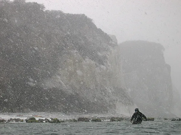 Weather permitting - Rough weather will often produce some fantastic pictures. But most anglers leave their camera in bags and pockets when it rains or snows. Be quick about it and shelter the camera with your jacket hood, and images like this can be captured with no harm to the camera.